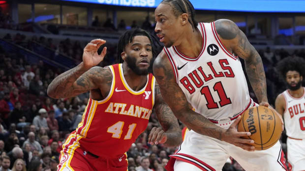 Chicago Bulls forward DeMar DeRozan (11) looks for an opening while Atlanta Hawks forward Saddiq Bey (41) defends during the first quarter at United Center. 